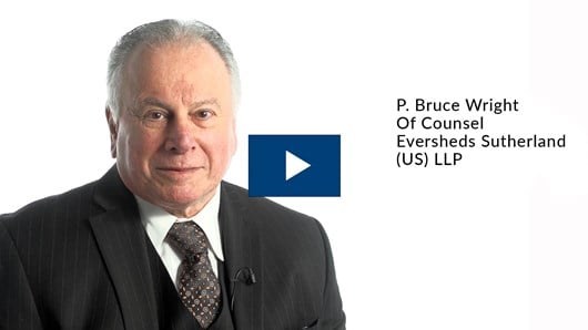 Headshot of Bruce Wright with a blue play button on top.