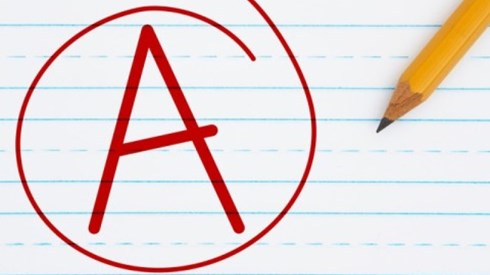A red capital letter A circled in red on a lined sheet of paper with a pencil next to it