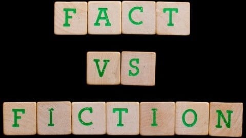 Fact versus Fiction written with scrabble tiles