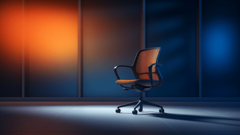 Office chair sitting under spotlight