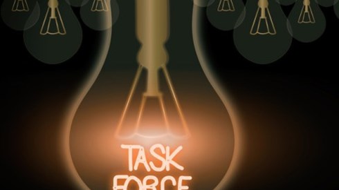 Task force written in neon inside lightbulb