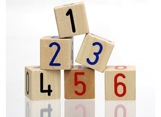 Wooden blocks numbered 1 through 6 with white background