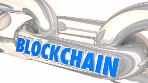 Blockchain written on the link of a chain