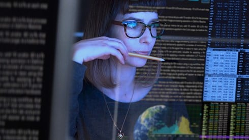 Woman reading and researching information on a screen