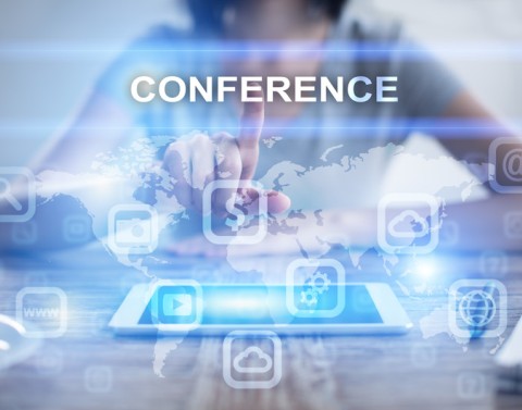 Woman selecting online conference on a tablet virtual screen