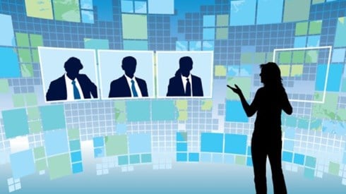 Silhouette of woman standing and talking to three silhouettes of people with virtual background