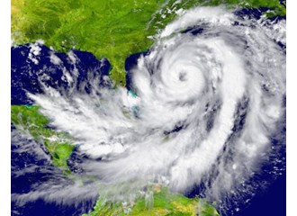 Hurricane extending from Caribbean Sea to Atlantic Ocean with the eye off the eastern United States just above Florida
