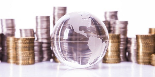 Clear Globe with Stacks of Coins in the Background