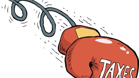 Moving boxing glove displaying the word taxes
