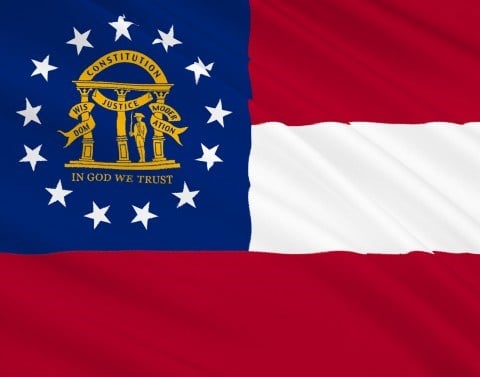 The flag of Georgia has stripes of red-white-red and at upper left a blue square with the coat of arms surrounded by 13 stars