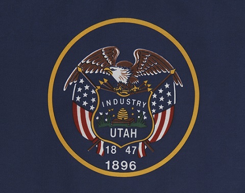 Utah flag--navy blue background, gold circle with eagle, flag, Industry, Utah, 1847, 1896 inside
