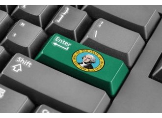 The Enter key on a computer keyboard is green and has the Washington State seal