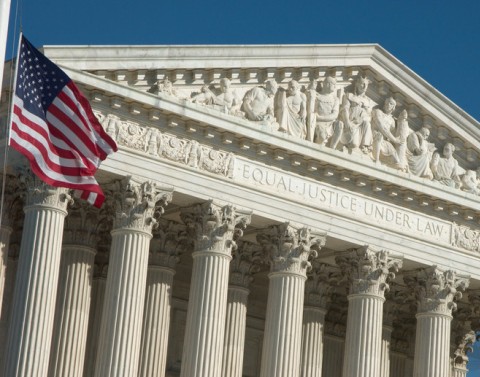 US Supreme Court building and flag