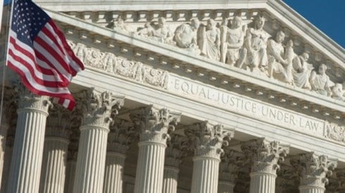 US Supreme Court building and flag