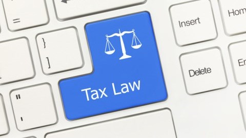 Tax Law written on the Enter button of a keyboard