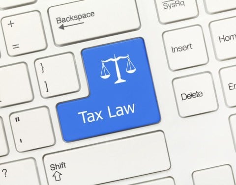 Tax Law written on the Enter button of a keyboard