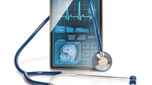 A tablet with medical information and a stethoscope draped over it