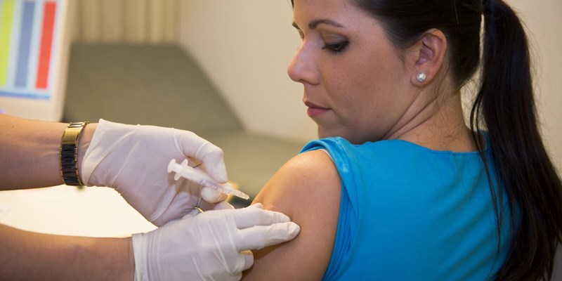 Woman getting vaccinated