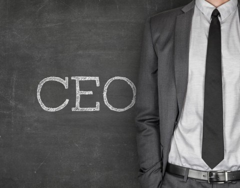 CEO Written On Chalkboard Next To Businessman