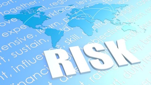Above risk-related words is a silhouette of continents with arches connecting cities and the word RISK in large letters