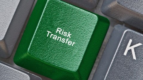 On a black computer keyboard, the J key is green and replaced with the words Risk Transfer.
